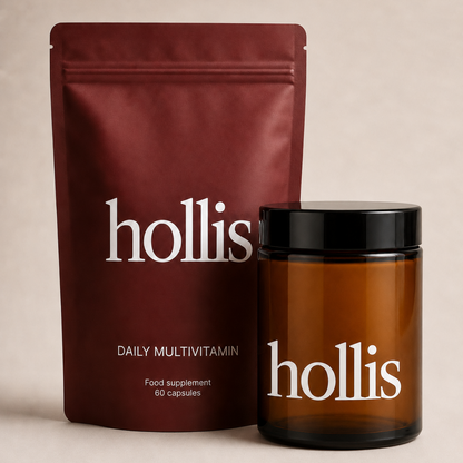 Hollis daily multivitamin packaging on a beige background